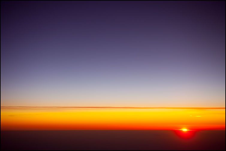 IMAGE: http://i282.photobucket.com/albums/kk258/Ken-Cravillion/Random%20Stuff/Sunrise-Inflight_2504.jpg